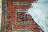 Close-up of antique Belouch runner's wide banded borders and tribal geometric patterns.