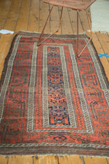 Antique Belouch runner corner, displaying geometric motifs and its distinctive wide borders.