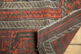 Antique Belouch rug runner with tribal banded patterns and visible goat hair cord selvage.