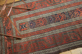 Unusual wide banded patterns on the antique Belouch runner with etching and cord selvage.