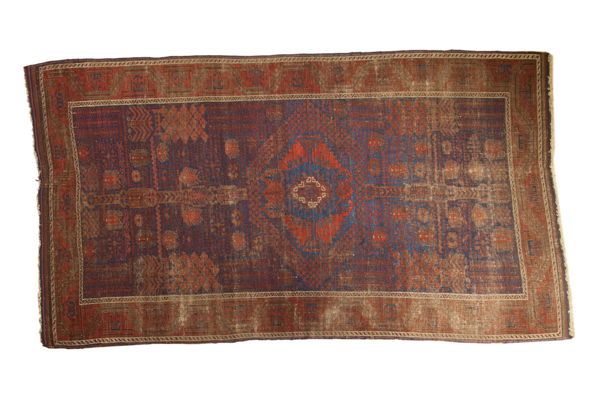 Antique Timuri Belouch rug with abrashed cobalt blue field and exotic tribal garden motifs, 4'8" x 8'4".