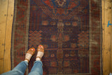Abrashed navy blue Timuri Belouch rug showcasing rare willow and palm garden motifs.