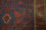 Etched red and blue tribal pattern and secured side of antique Timuri Belouch rug.
