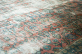 Blush and sky blue oversized vinery and blossoms on a distressed vintage Mahal rug.