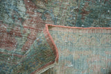 Distressed vintage Mahal rug pile showing wear, secured edge, and hand-knotted foundation.