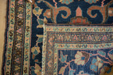Detail of a vintage Hamadan rug corner, showing hand-knotted construction, delicate vinery, and secure side binding.