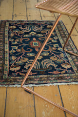 Secured fringe and potted flower motif at the end of the vintage Hamadan rug.