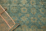 Allover mina khani pomegranate trellis design in sky blue and pale copper on vintage Lilihan carpet.