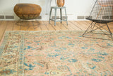 Vintage Tabriz carpet border, peach field, and sky blue lotus flowers.