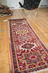 Geometric medallions and floral field with charismatic multi-colored selvage on the Karaja runner.
