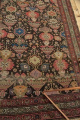 Antique Malayer rug border and field detail with meandering mir boteh, potted plants, and light foundation showing.