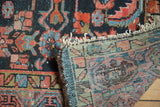Vintage Persian Hamadan rug's hand-knotted indigo Herati pattern pile, exposed reverse weave, secure fringe.