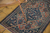 Fine Senneh rug's intricate Herati pattern in dark indigo, brick red rust, and sky blue.