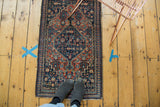 Vintage Fine Senneh rug's lower corner, featuring intricate Herati pattern and delicate fringe.
