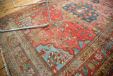 Farahan Sarouk rug corner with blush rose and blue motifs, showing exposed foundation.
