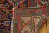 Antique Hamadan runner's fringed edge, ivory foundation, and geometric hand-knotted weave.