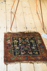 Vintage Kurdish Bag Face rug with geometric plants, flowers, in deep blues, rust, and greens.