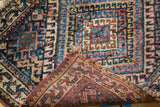 Hand-knotted antique Jaff Kurd rug revealing diamond motif, woven foundation, and characterful pile.