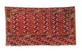 Vintage Turkmen Tent Cover rug, repeating geometric guls in brick red, navy, and ivory.