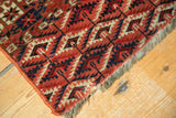 Vintage Turkmen Tent Cover rug corner: brick red, navy, ivory geometric guls, and neat fringe.