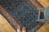 Herati motif in indigo blue, cochineal red, and antique ivory on a Malayer rug.