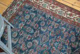 Vintage Persian Malayer rug's repeating Herati motif, indigo, red, and low pile.