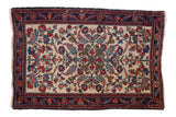 Antique Fine Hamadan rug with an elaborate curvilinear design in red, blue, and blush on an ivory field.