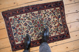 Antique Hamadan rug mat with intricate floral patterns viewed on a floor for scale.