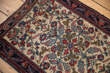 Exquisite curvilinear floral detail in the corner spandrel of a fine antique Persian Hamadan rug.