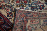 Hand-knotted construction and secured end finish of an antique fine Hamadan rug mat.