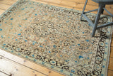 Hand knotted Persian Sarouk field with charcoal brown tendrils, blue floral on peach and ivory.