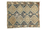Vintage Caucasian rug with repeating beige diamond panels on dusty teal field, 3'9