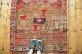Antique Caucasian hand-knotted runner, geometric triple medallion in brilliant green and cochineal red.