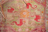 Antique Caucasian runner's green, cochineal red, tangerine orange geometric pattern, showing even wear.