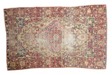 Antique Persian Kermanshah rug, oversize scalloped medallion, ivory, cochineal red, and sky blue.