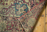 Hand-knotted foundation, restrung red edge, and worn pile of an antique Kermanshah rug.