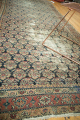 Dense repeating boteh motifs on antique Malayer runner with brick red patterned border.