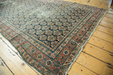 Antique Malayer runner's ornate brick red border with repeating floral boteh pattern.