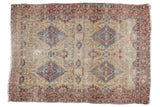 Antique Kermanshah rug with a rare allover pattern in cochineal red and sky blue on an ivory ground.