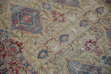 A view of threadbare areas exposing the foundation of an antique Kermanshah rug's design.