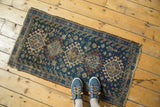 Geometric gul and starburst patterns with hook-and-latch contouring on vintage Afshar rug.