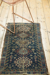 Geometric animal motifs, starbursts, and hook and latch patterns on a vintage Afshar rug.