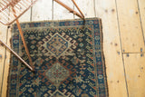 Gul, starburst, and animal patterns on vintage Afshar rug in indigo, ivory, terra cotta.