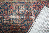 North West Persian rug, geometric Herati pattern on navy, with foundation showing from wear.