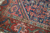 Textured pile showing geometric Herati motif and samovar border in navy, brick red, and green.