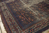 Antique Belouch prayer rug with indigo, brown, apricot geometric patterns, starburst border, visible foundation.