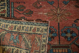 Hand knotted antique Lilihan rug detail showing pile wear with white knots and reverse border.