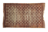 Antique hand-knotted Persian Belouch rug with geometric pomegranate lattice in faded terra cotta and charcoal.
