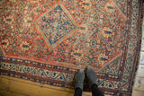 Vintage Mahal rug featuring allover henna plant motif in terra cotta red and sky blue with even wear.