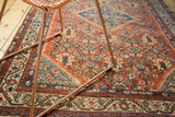 Vintage Persian Mahal rug field featuring terra cotta henna plant trellis and sky blue designs.